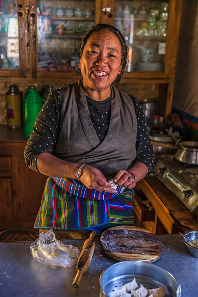 Tibetan woman making momos nomads